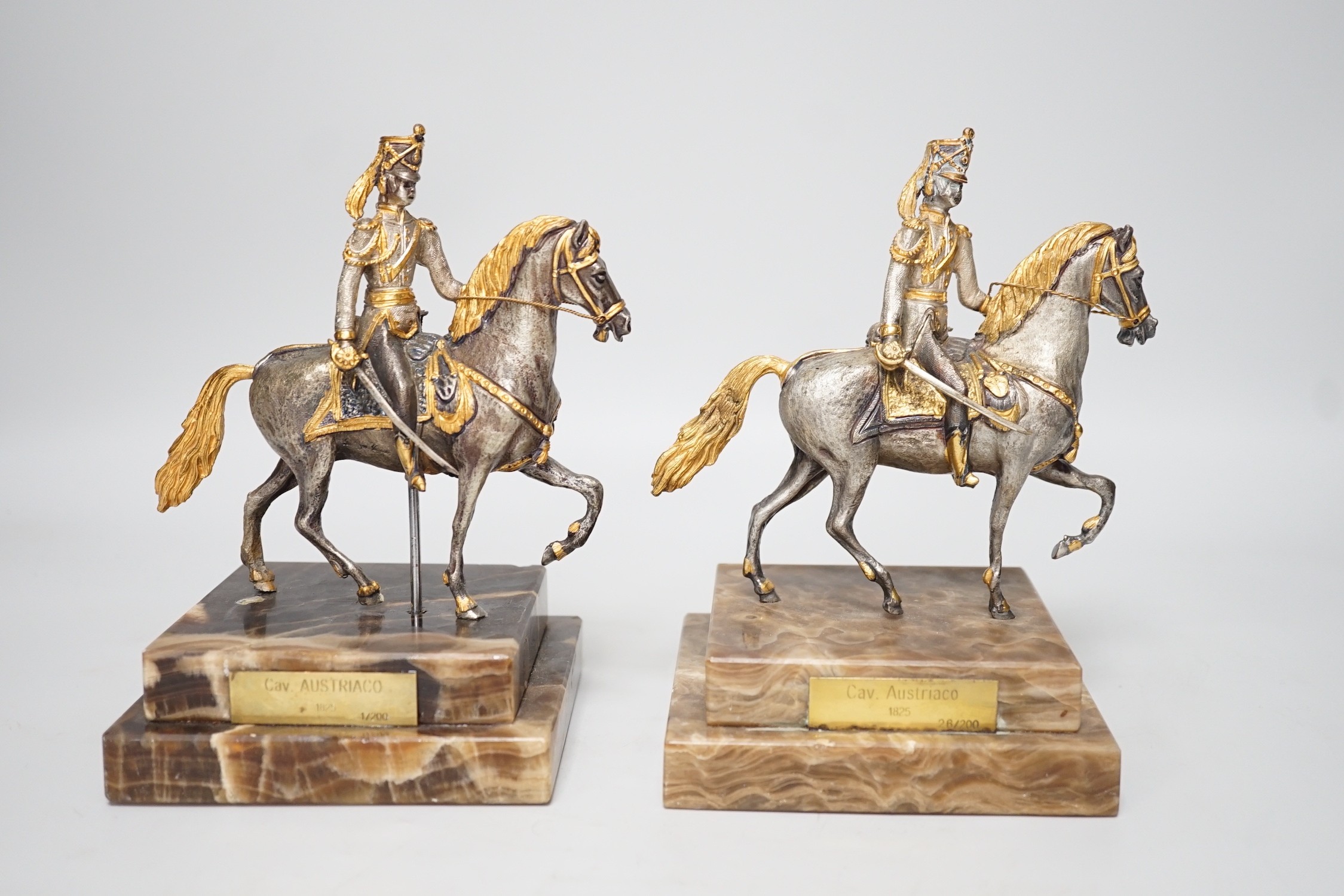 Two limited edition gilt bronze of horseback riders on marble bases, plaques read ‘Cav. AUSTRIACO 1825 1/200’ and ‘26/200’ 17cm